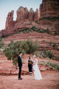 Brandi snapping a photo of Christy and Dustin during their elopement ceremony