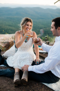 Bride and groom making a cheers to their elopement 